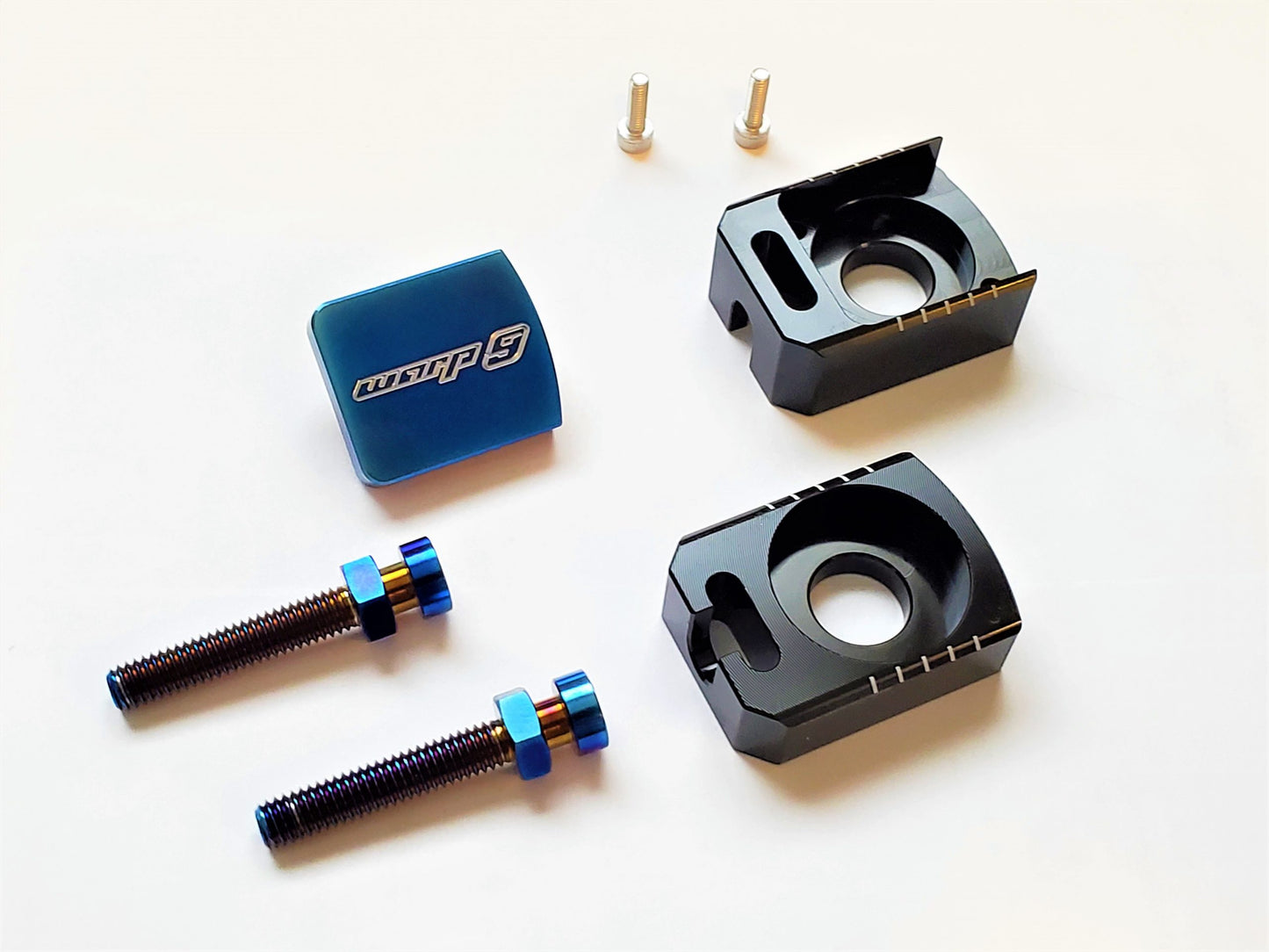 Warp 9 Titanium Surron Axle Blocks